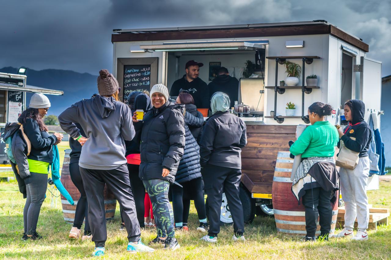 BRU. truck serving a crowd at an outdoor event